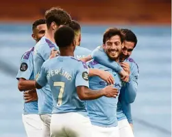  ??  ?? Taking a bow: Manchester City’s David Silva (second from right) celebrates scoring their fourth goal with teammates against Newcastle at the Etihad. — Reuters