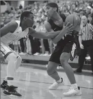  ?? NWA Democrat-Gazette/ANDY SHUPE ?? Bentonvill­e’s Connor Deffebaugh (right) looks to drive past Fayettevil­le’s Darius Bowers.