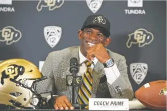  ?? AP PHOTO/DAVID ZALUBOWSKI ?? Deion Sanders speaks after being introduced as the new head football coach at the University of Colorado during the Dec. 4 news conference.