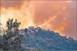  ?? AFP ?? Smoke rises from a wildfire in the forested hills of the Kabylie region, east of the capital Algiers.