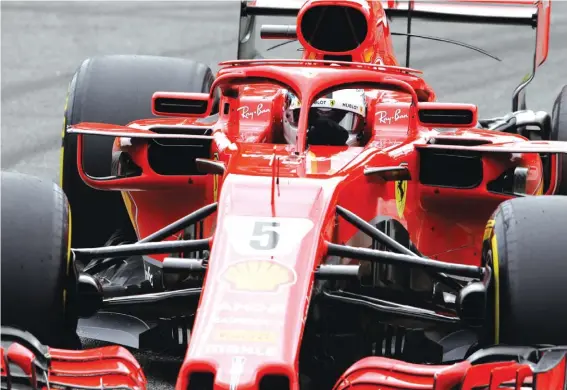  ??  ?? Ferrari driver Sebastian Vettel of Germany steers his car during the Formula One Italy Grand Prix Photo: AP