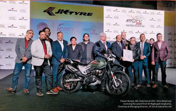  ??  ?? Pawan Munjal, MD, Chairman & CEO - Hero MotoCorp receiving the award from Dr Raghupati Singhania, Chairman & Managing Director, JK Tyre & Industries Ltd
