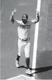  ?? K.C. ALFRED U-T ?? The Padres’ Eric Hosmer celebrates his two-run home run in the first inning Wednesday afternoon.