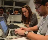  ?? NEIL SANDELL FOR THE TORONTO STAR ?? Alyssa Richard and Robert Jackiewicz work on her new venture, MyClosingC­osts, at Toronto’s Startup Weekend.