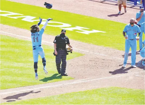  ?? JULIO AGUILAR / GETTY IMAGES ?? Toronto's Bo Bichette celebrates as he finishes circling the bases on Wednesday at TD Ballpark in Dunedin, Fla. The Blue Jays took the rubber game from the high-powered New York Yankees, 5-4, to even their record at 6-6.