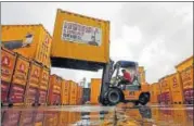  ?? REUTERS ?? A forklift operator stacks containers at the godown of Agarwal Packers and Movers Ltd. on the outskirts of Mumbai.