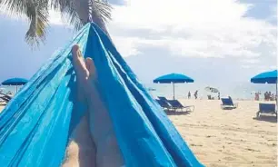  ?? PATRICK CONNOLLY/ORLANDO SENTINEL ?? Going to the beach and relaxing in a hammock are two ways to spend National Relaxation Day on Aug. 15.