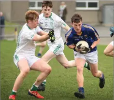  ??  ?? Wicklow Schools’ Thomas Kearns looks to make ground in Enniscorth­y.