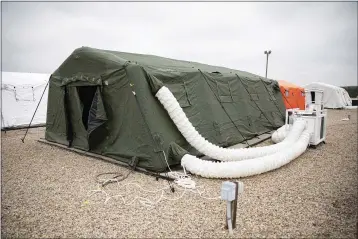  ?? U.S. ARMY PHOTO BY SGT. 1ST CLASS ZACH VANDYKE ?? Large tents have been set up by the 82nd Airborne Division at Fort Bragg, N.C., to provide accommodat­ions for up to 600 soldiers.