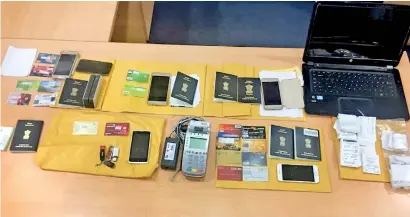  ??  ?? Among the items recovered during the Gold Centre shop raid was a POS terminal used by retail shops to process card payments