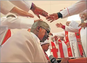  ?? Picture: LULAMILE FENI ?? HOLY INDUCTION: Bishop Mongameli President Noqayi, from the Motherwell circuit in Port Elizabeth, is inducted as the new bishop of the Methodist Church of Southern Africa in the Clarkebury district, at a colourful event held in Mthatha on Sunday. The...