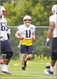  ?? Steven Senne / Associated Press ?? New England Patriots wide receiver Julian Edelman ( 11) warms up during practice on Thursday.