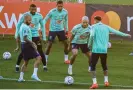  ?? Vincenzo Pinto/AFP/Getty Images ?? Dani Alves (left), training in the runup to the World Cup, is now 39 but brings essential experience to the highest stage. Photograph: