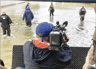  ?? GABRIELLE ENRIGHT PHOTOS / STAFF ?? WHIO-TV’s Chuck Hamlin covers Ohio Task Force 1 on a rescue mission in Texas during Tropical Storm Harvey.