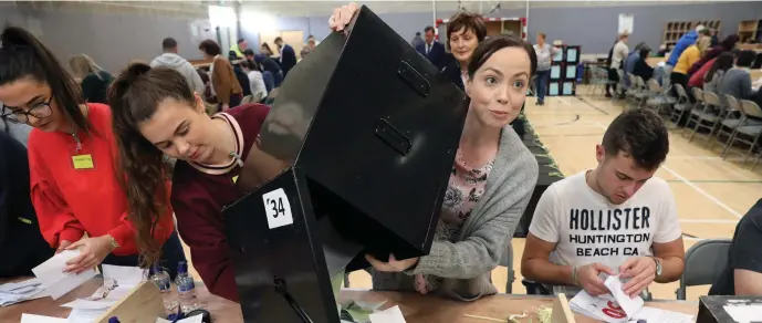  ??  ?? Opening the boxes at the Election Count in Summerhill College on Saturday. Pic: Carl Brennan.