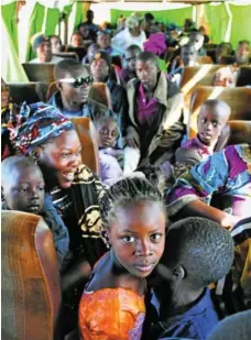 ?? JOE PENNEY/REUTERS ?? Malian bus passengers fleeing fighting wait at a checkpoint in Mali.
