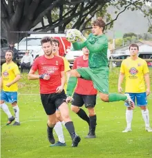  ?? Photo / Bevan Conley ?? Wanderers keeper Thomas Hooper covers a cross during his side’s match in Whanganui.