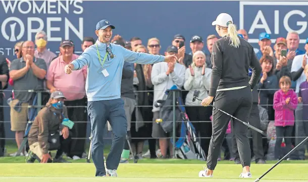  ??  ?? SWEDE DREAMS: Anna Nordqvist goes to hug her husband Kevin McAlpine as she wins the Women’s British Open championsh­ip at Carnoustie.