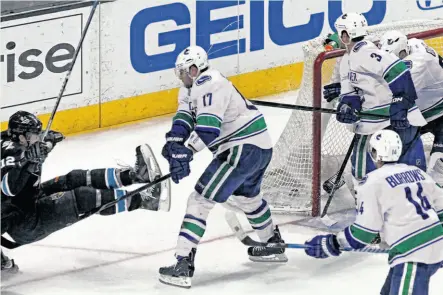  ?? Lance Iversen / The Chronicle ?? The Sharks’ Patrick Marleau (left) goes down after his winning goal on a power play in the 14th minute of overtime.