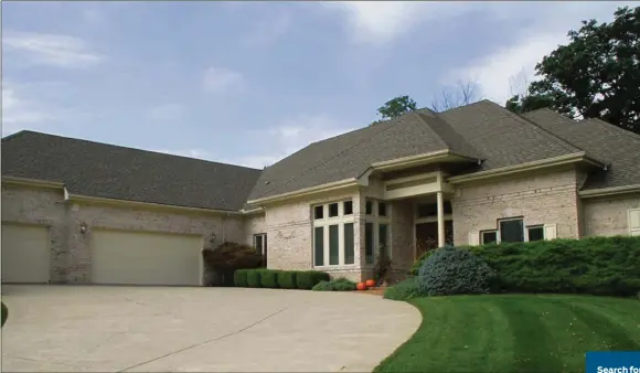  ?? CONTRIBUTE­D PHOTOS BY KATHY TYLER ?? A pale brick facade with a covered front porch defines this French Contempora­ry ranch home in Beavercree­k. Curving past the front porch to the 3-car garage, the driveway creates a courtyard effect enhanced with landscaped flower beds.