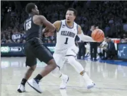  ?? CHRIS SZAGOLA — THE ASSOCIATED PRESS ?? Villanova’s Jalen Brunson, right, makes a move past Georgetown’s Trey Dickerson in a game last Saturday. Brunson’s recognitio­n as the Big East Player of the Year Wednesday doesn’t impact his stock in the NBA draft, but his track record means he’s not a...