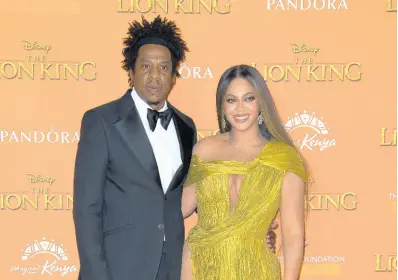  ?? AP ?? Power couple Jay-Z, left, and Beyoncé and Jay-Z have reportedly spent $200 million on a 30,000 square-foot home in the “prime area” of Malibu, in what has been called the “most expensive” house ever sold in the state of California. The property is locatred in an area known as Billionair­es Row.