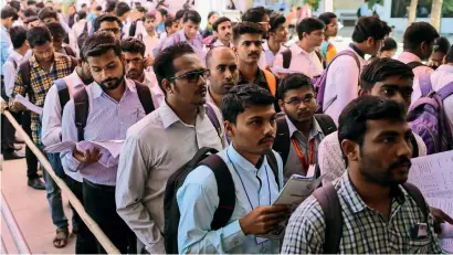  ?? Reuters ?? THe QUeUeS keeP geTTIng LOngeR: Job seekers line up on February 7, 2019, for interviews at a job fair in Chinchwad, Pune. —