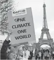  ?? FRANCOIS GUILLOT, AFP/ GETTY IMAGES ?? Demonstrat­ors rally in Paris in December 2015 during the U. N. Climate Change Conference, where a pact signed by 180 nations was worked out.