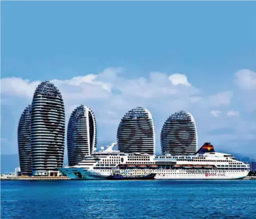  ??  ?? 2014: Five magnificen­t hotel buildings on Phoenix Island in Sanya Bay, Hainan. Constructi­on of the Internatio­nal Tourism Island aims at becoming a world-class island tourism destinatio­n. The push has enabled its tourism industry to take the initiative...