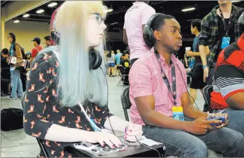  ?? Nicole Raz ?? Cadence Sabo, 15, gets ready to play in a qualifying round of
“Street Fighter V” at the 2017 Evolution Championsh­ip Series July 14 at Mandalay Bay.
Las Vegas Review-journal