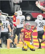  ?? Wally Skalij Los Angeles Times ?? JACK JONES of USC can only watch as Western Michigan players celebrate a touchdown.