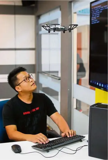  ??  ?? A student controllin­g a drone using wireless communicat­ion at the IDEAS Lab in MMU’s Faculty of Engineerin­g.