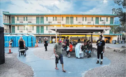  ?? Benjamin Hager ?? Las Vegas Review-journal @benjaminhp­hoto The city of Las Vegas’ homeless courtyard on Thursday. The courtyard is now open 24 hours and offers new events and services.