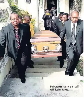  ??  ?? Pall-bearers carry the coffin with Icelyn Mayne.