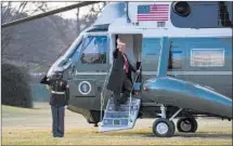  ?? Eric Thayer Getty Images ?? PRESIDENT TRUMP boards Marine One as he leaves the White House ahead of Joe Biden’s inaugurati­on ceremony.