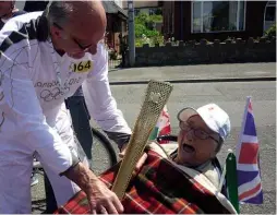  ??  ?? ABOvE: The author’s mother carrying the Olympic torch in May 2012. OPPOsITE: The ‘Witch Way’ branding produced by the author’s brother for the X43 bus.