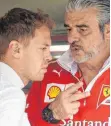  ?? FOTO: AFP ?? Noch ist da Hoffnung: Sebastian Vettel (li.), Maurizio Arrivabene.