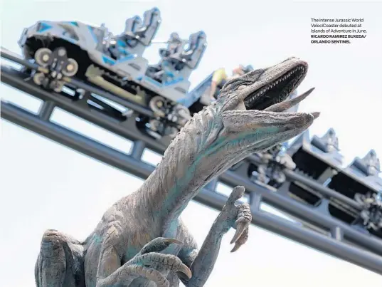  ?? RICARDO RAMIREZ BUXEDA/ ORLANDO SENTINEL ?? The intense Jurassic World VelociCoas­ter debuted at Islands of Adventure in June.