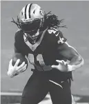  ?? BUTCH DILL/AP ?? Saints running back Alvin Kamara carries against the Bears on Sunday.