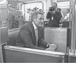  ?? CAROLYN KASTER/AP ?? Sen. Jeff Flake boards the subway Thursday on Capitol Hill in Washington, D.C.