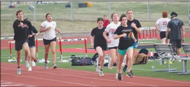  ?? Daniel Bereznicki/McDonald County Press ?? Students race at Mustang Stadium on the first week of practice to try out for the track team.