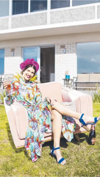  ?? Picture: Eddie Safarik ?? Fashions on Your Front Lawn 2019 Tasmanian state winner Ellie Sheridan encourages people to join in the fun leading up to Melbourne Cup week.