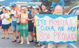 ?? ?? Locals show up with banners to support rugby champion Krystal Murray returning home to Kaita¯ ia.