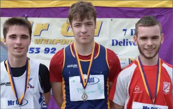  ??  ?? The boys’ Under-18 800m (from left): Sam Molyneaux (Kilmore, second), Paul Freeman (St. Killian’s, first), Adam Kehoe (D.M.P., third).