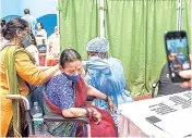  ??  ?? An elderly person being administer­ed the COVID-19 vaccine in Mumbai on Saturday