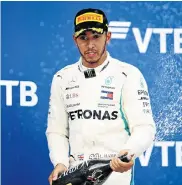  ?? Picture: MARK THOMPSON/GETTY IMAGES ?? TITLE BECKONS: Race winner Lewis Hamilton of Great Britain and Mercedes GP celebrates on the podium after the Formula One Grand Prix of Russia at the Sochi Autodrom in Sochi, Russia on Sunday