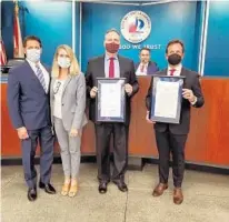  ?? CITY OF FORT LAUDERDALE/COURTESY ?? Former state Rep. George Moraitis, from left, and his wife, Commission­er Heather Moraitis, stand with Westminste­r Academy Headmaster Joel Satterly and Coral Ridge Presbyteri­an Church Lead Pastor Rob Pacienza after Fort Lauderdale honored the church and its school with a proclamati­on on March 16. Mayor Dean Trantalis smiles in the background.