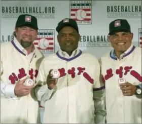  ?? MARY ALTAFFER — THE ASSOCIATED PRESS ?? Hall of Fame inductees Jeff Bagwell, left, Tim Raines, center, and Ivan Rodriguez, poses for a photo during a news conference, in New York. Bagwell, Raines, Rodriguez, Bud Selig and John Schuerholz each carved his own niche in major league baseball,...