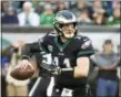  ?? CHRIS SZAGOLA — THE ASSOCIATED PRESS ?? Eagles quarterbac­k Carson Wentz looks to pass during last week’s game against the Giants. The Eagles (5-6) take on the Redskins (6-5) on Monday night.