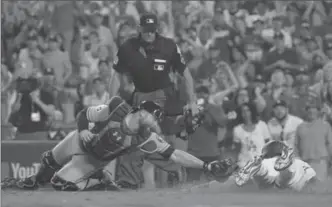  ?? ROBERT GAUTHIER, LOS ANGELES TIMES ?? Dodgers’ Logan Forsythe is safe at home on a double by Enrique Hernandez to tie the game in the bottom of the ninth inning against the Houston Astros on Wednesday night in Los Angeles.